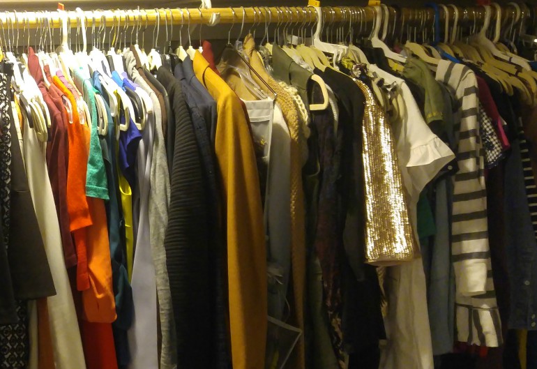 Organized Clothes Hanging in Closet